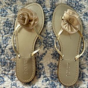 J.CREW gold leather flip flops with material flower on top